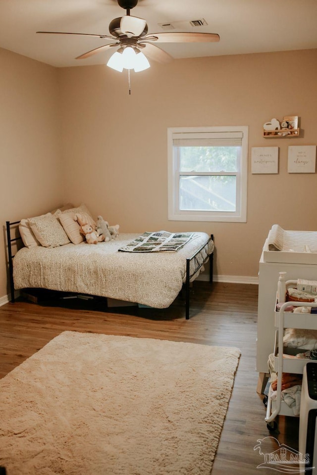 3125 Zepp Ln, Pace, FL 32571 - bedroom with wood finished floors and ceiling fan