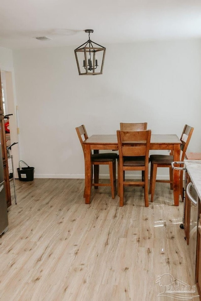 3125 Zepp Ln, Pace, FL 32571 - dining space featuring light wood-type flooring and a chandelier