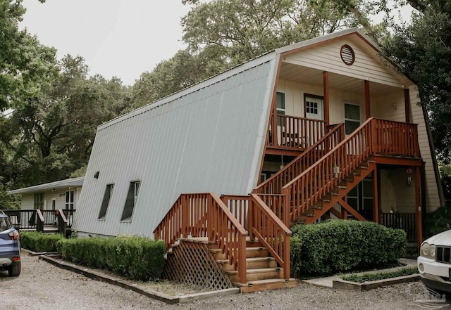3125 Zepp Ln, Pace, FL 32571 - rear view of property with stairs and covered porch