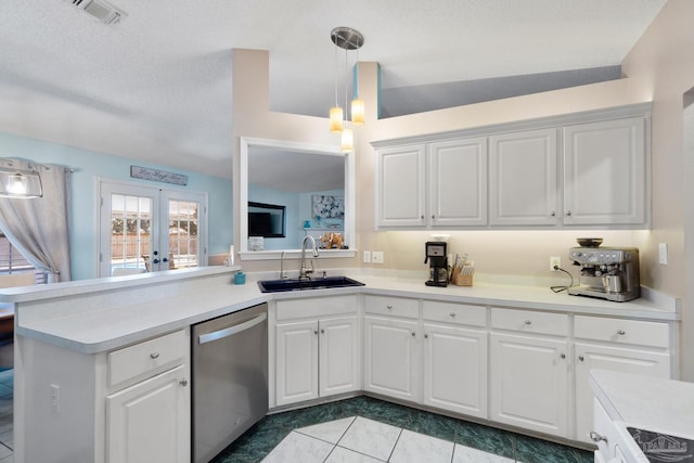 kitchen with white cabinetry, sink, and stainless steel dishwasher