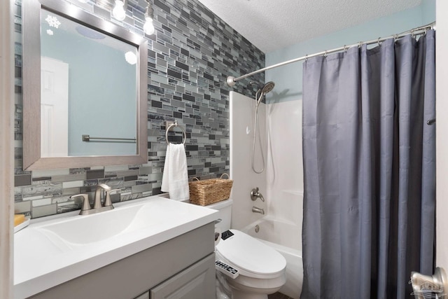 full bathroom featuring tasteful backsplash, vanity, a textured ceiling, shower / bathtub combination with curtain, and toilet