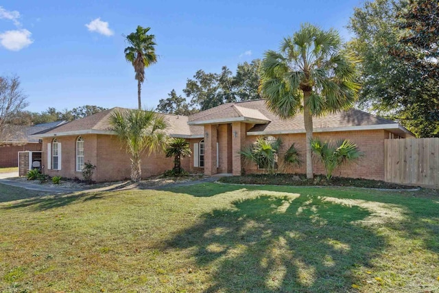 ranch-style house featuring a front lawn