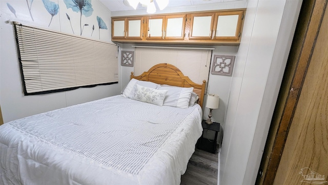 bedroom with wood-type flooring