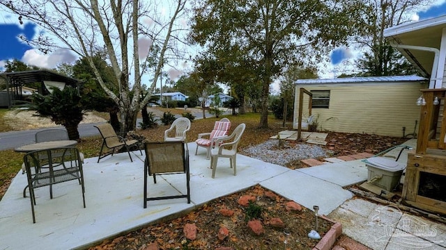 view of patio featuring an outdoor structure