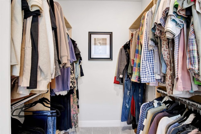 spacious closet with carpet flooring