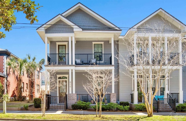 view of front of house with a porch and a balcony