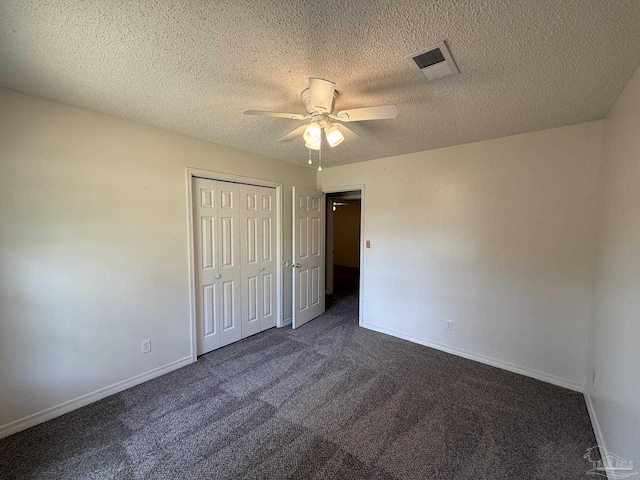 unfurnished bedroom with carpet flooring, a closet, visible vents, and baseboards