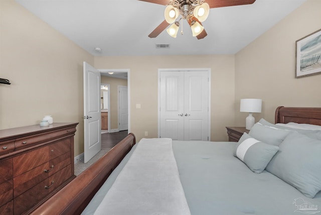 bedroom with a closet, ceiling fan, and hardwood / wood-style flooring