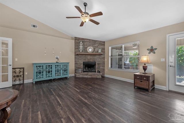 living room with ceiling fan, dark wood-type flooring, a fireplace, and vaulted ceiling