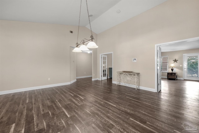 interior space with high vaulted ceiling and dark hardwood / wood-style flooring