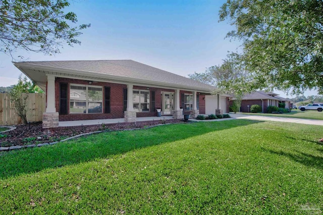 single story home featuring a front lawn and a garage