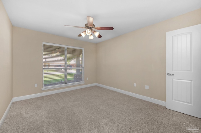 carpeted empty room with ceiling fan