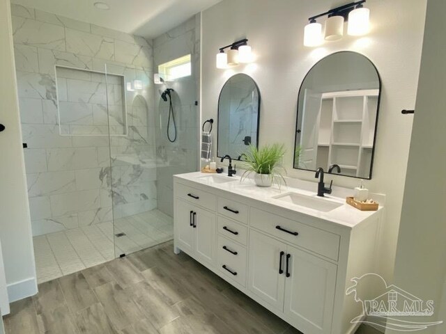 kitchen with light hardwood / wood-style floors, white cabinetry, dishwasher, gray cabinets, and sink