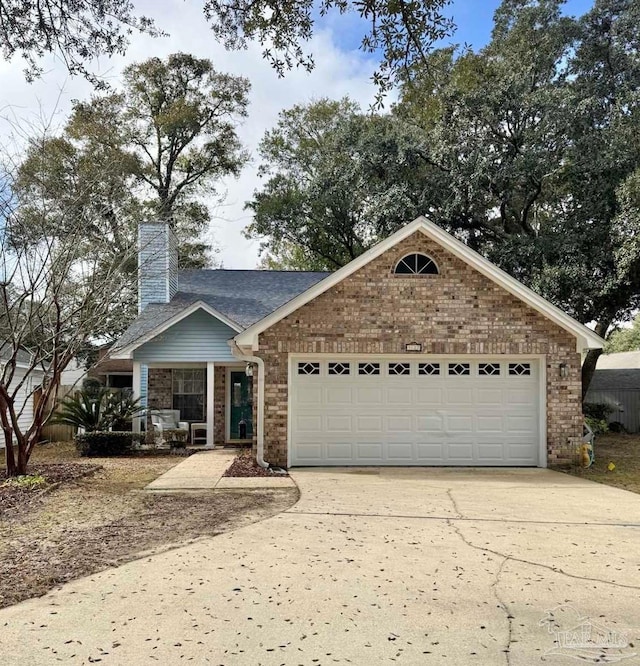 view of front of home with a garage and a porch