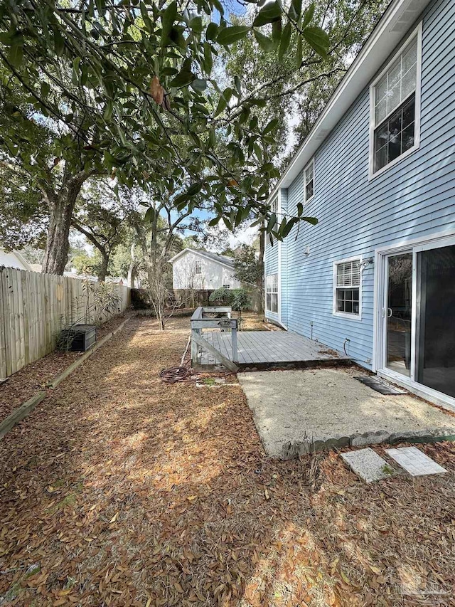 view of yard with a wooden deck