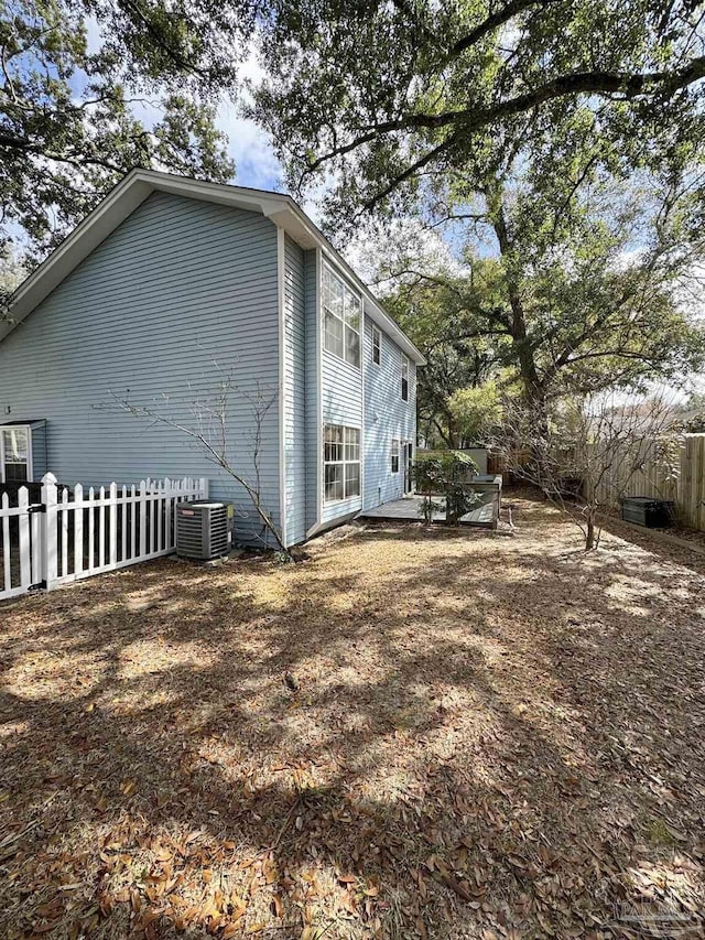 view of side of property with cooling unit