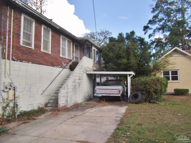 view of home's exterior featuring a carport