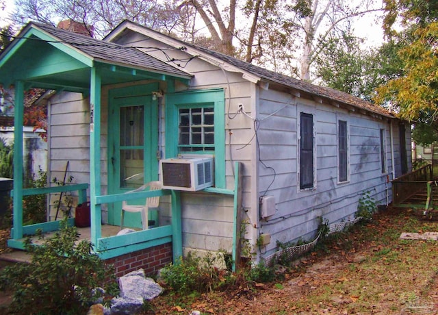 view of side of property featuring cooling unit