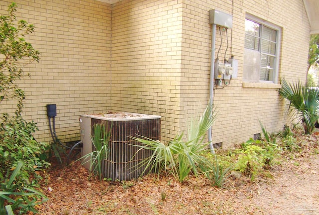 view of side of home featuring central air condition unit