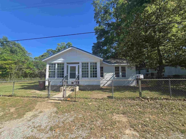 bungalow-style home with a gate and a fenced front yard
