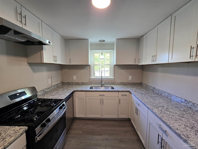 kitchen with white cabinets, a sink, stainless steel appliances, under cabinet range hood, and dark wood-style floors