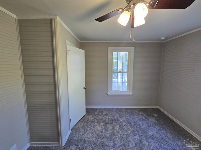 unfurnished bedroom featuring crown molding, ceiling fan, carpet, baseboards, and a closet