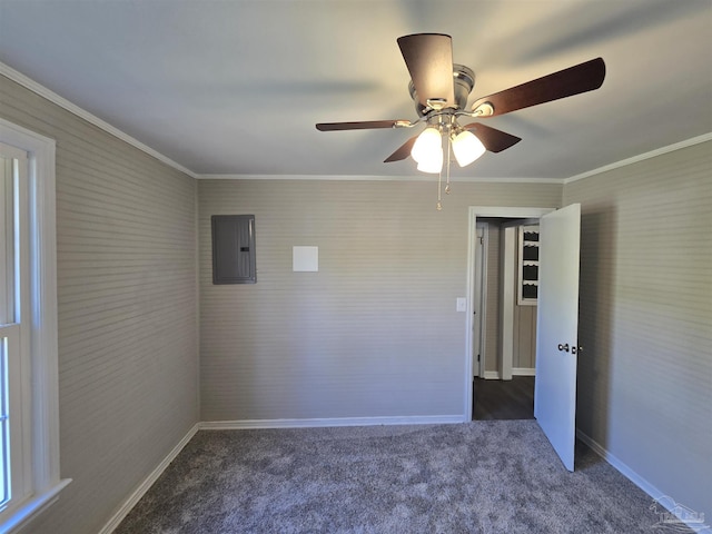 carpeted empty room featuring a ceiling fan, baseboards, ornamental molding, and electric panel