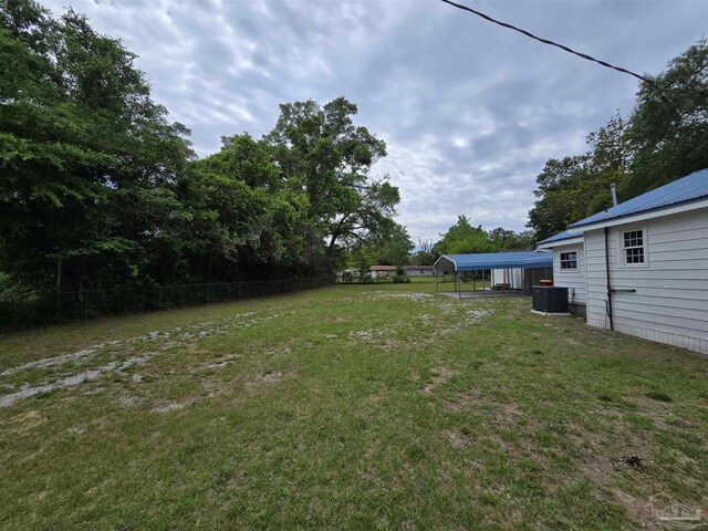 337 E Chestnut Ave, Crestview, FL 32539 - view of yard with central air condition unit and a carport