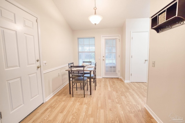 dining space with light hardwood / wood-style floors