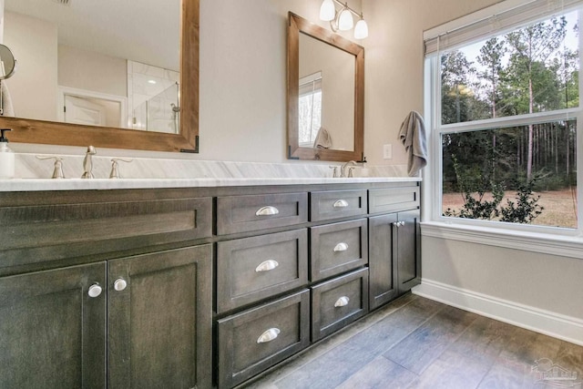 bathroom featuring vanity and wood-type flooring