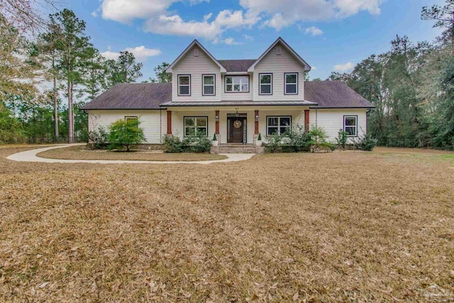 view of front of home featuring covered porch and a front lawn