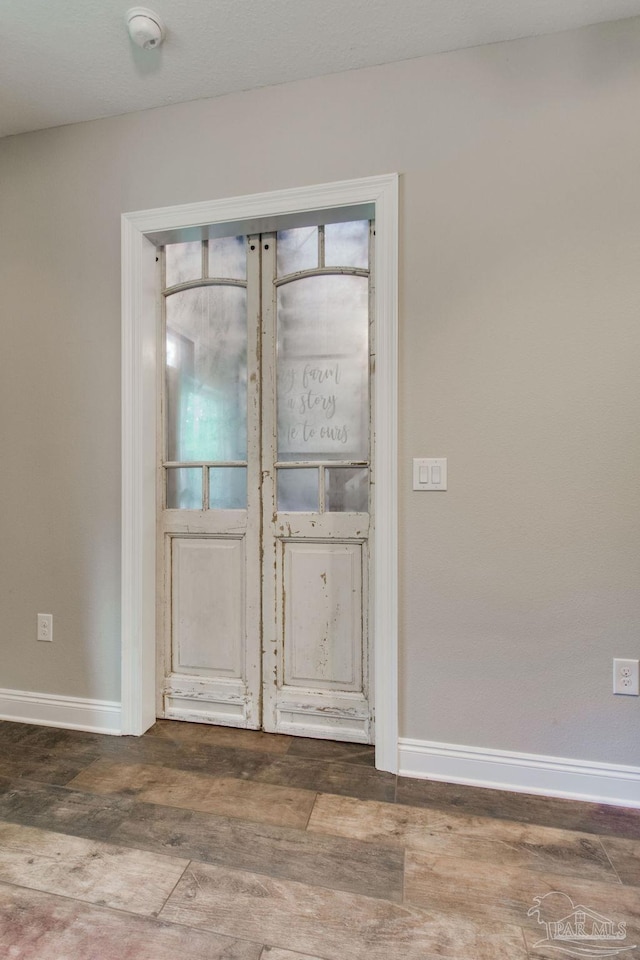 entrance foyer featuring dark hardwood / wood-style floors