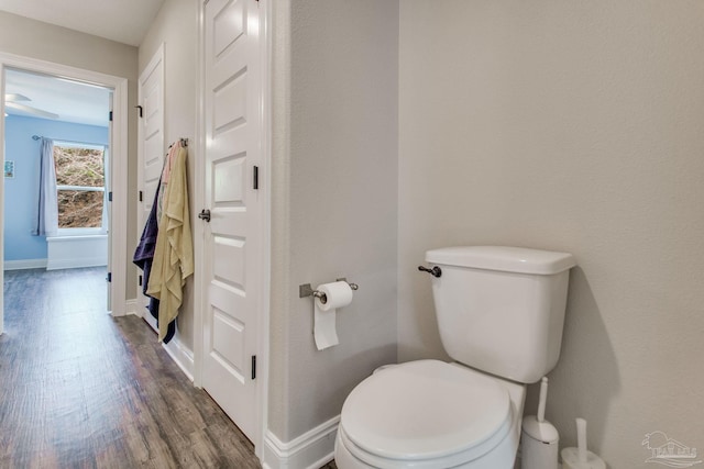 bathroom featuring hardwood / wood-style floors and toilet