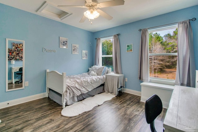 bedroom with dark hardwood / wood-style floors and ceiling fan