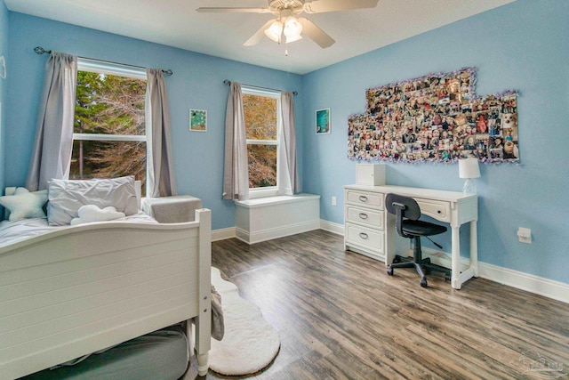 bedroom featuring ceiling fan and dark hardwood / wood-style flooring