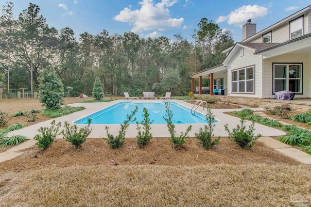 view of pool featuring a patio