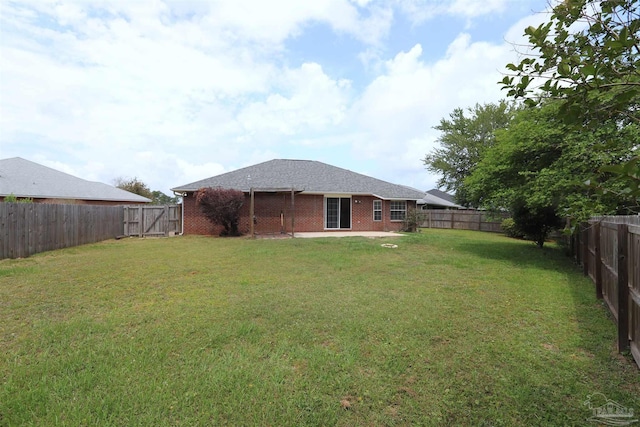 view of yard with a fenced backyard