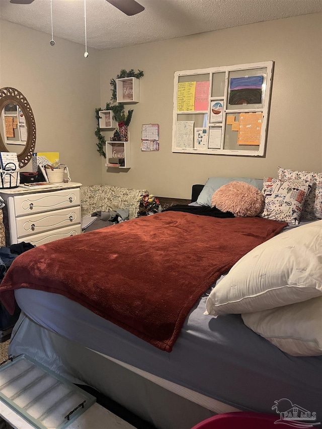 bedroom featuring a textured ceiling