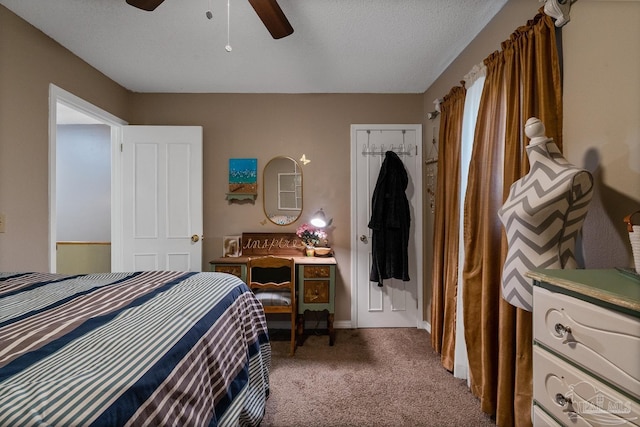 bedroom with ceiling fan, a textured ceiling, carpet, and baseboards