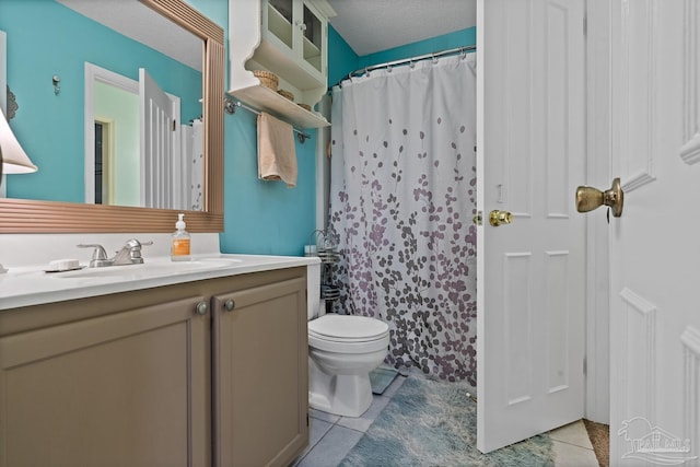 full bath featuring a shower with shower curtain, toilet, tile patterned floors, a textured ceiling, and vanity