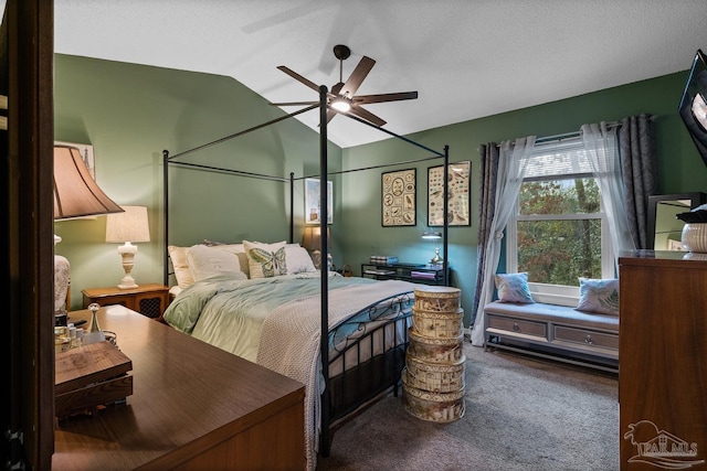 bedroom with carpet flooring, vaulted ceiling, and ceiling fan