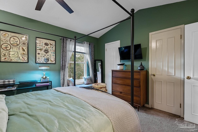 bedroom with a ceiling fan, carpet flooring, and vaulted ceiling