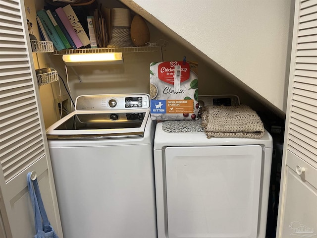 washroom featuring washer and dryer and laundry area