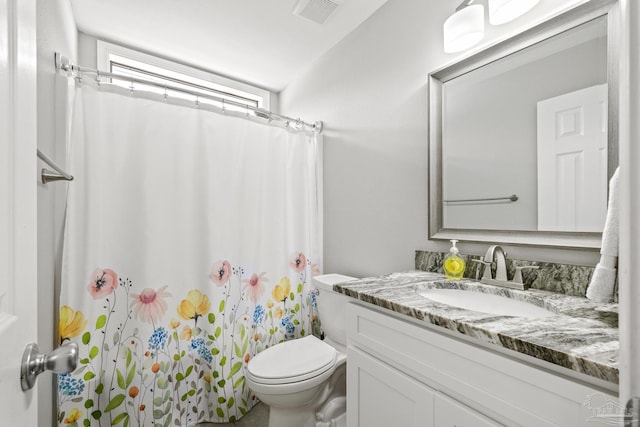 bathroom with vanity, toilet, a shower with curtain, and visible vents