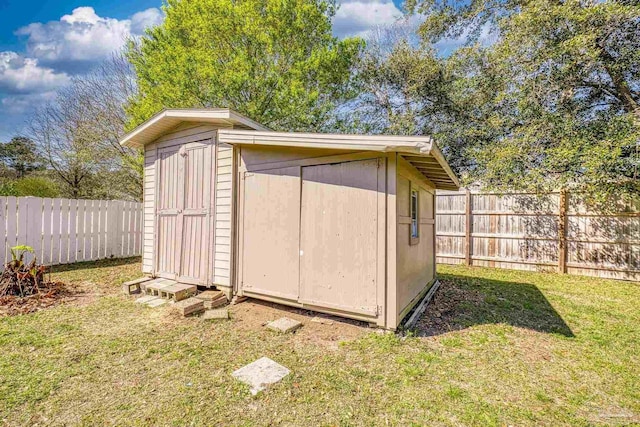 view of shed featuring a fenced backyard