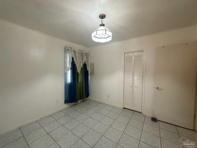 4681 Kingston Dr, Pensacola, FL 32526 - spare room featuring light tile patterned floors and ornamental molding
