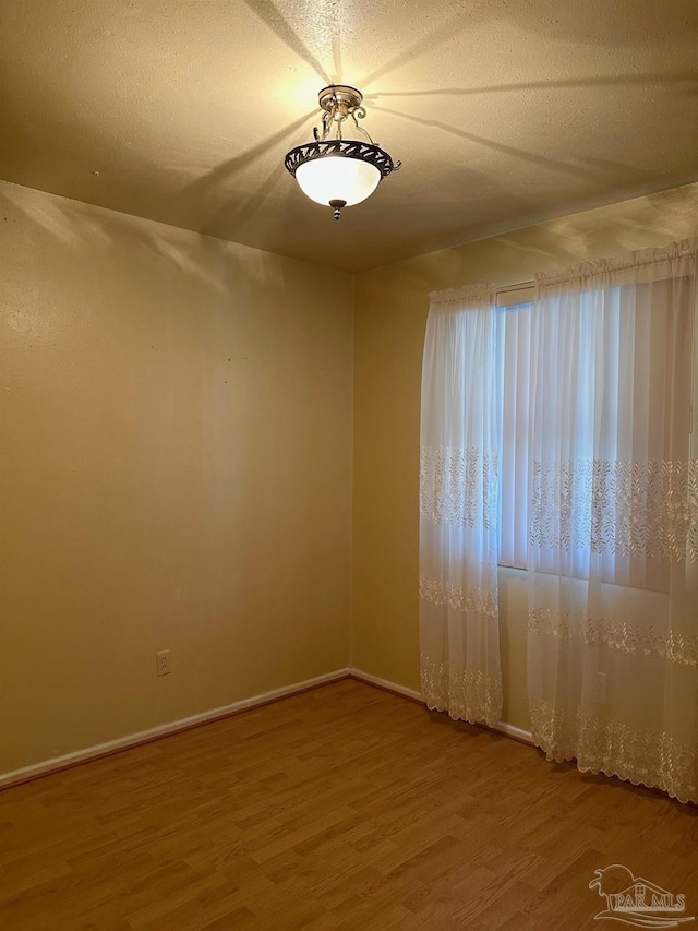 4681 Kingston Dr, Pensacola, FL 32526 - spare room with wood finished floors and baseboards