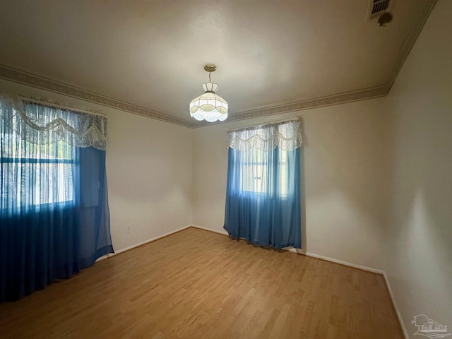 4681 Kingston Dr, Pensacola, FL 32526 - unfurnished room featuring wood finished floors, ornamental molding, and baseboards