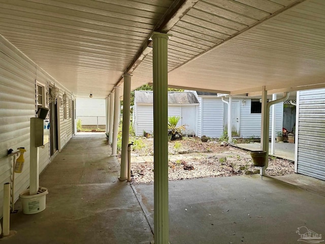 4681 Kingston Dr, Pensacola, FL 32526 - view of patio / terrace featuring an outdoor structure and a storage unit