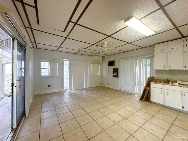 4681 Kingston Dr, Pensacola, FL 32526 - spare room with light tile patterned floors, a sink, and ceiling fan